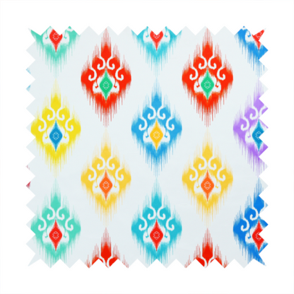 The image features a colourful, patterned textile with an ikat-style design and repeating diamond motifs.
