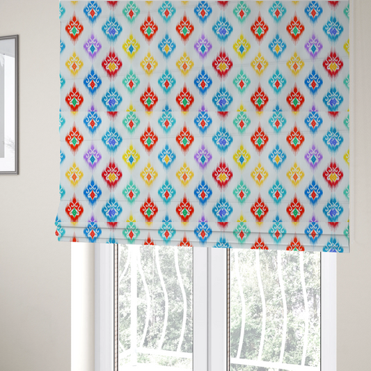 The fabric used to create these Roman blinds is a colourful, patterned textile with an ikat-style design and repeating diamond motifs.
