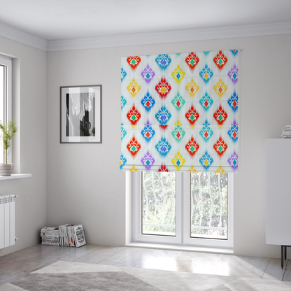 The fabric used to create these Roman blinds is a colourful, patterned textile with an ikat-style design and repeating diamond motifs.