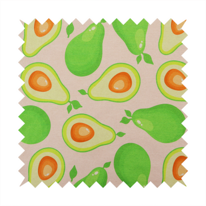 A repeating pattern fabric featuring whimsical illustrations of whole green avocados with small leaves and sliced avocado halves showing bright orange pits, all scattered across a light pink background.