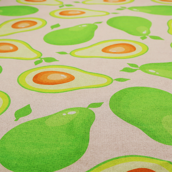 A repeating pattern fabric featuring whimsical illustrations of whole green avocados with small leaves and sliced avocado halves showing bright orange pits, all scattered across a light pink background.
