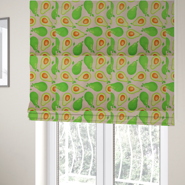 The fabric used to create these roman blinds is a repeating pattern fabric featuring whimsical illustrations of whole green avocados with small leaves and sliced avocado halves showing bright orange pits, all scattered across a light pink background.