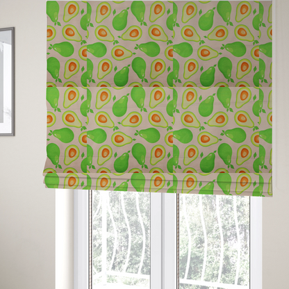 The fabric used to create these roman blinds is a repeating pattern fabric featuring whimsical illustrations of whole green avocados with small leaves and sliced avocado halves showing bright orange pits, all scattered across a light pink background.