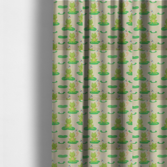 The fabric used to create these made-to-measure curtains is a repeating pattern fabric featuring cute cartoon green frogs sitting on bright green lily pads, interspersed with blue and red dragonflies and white water lilies on a light cream background.
