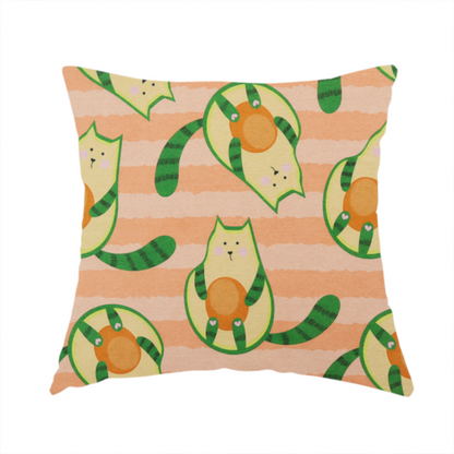 The fabric used to create this handmade cushion is a playful repeating pattern fabric featuring whimsical illustrated "avocatos"—cats shaped like avocado halves with green striped tails and orange pits—over a light peach background with horizontal orange stripes.