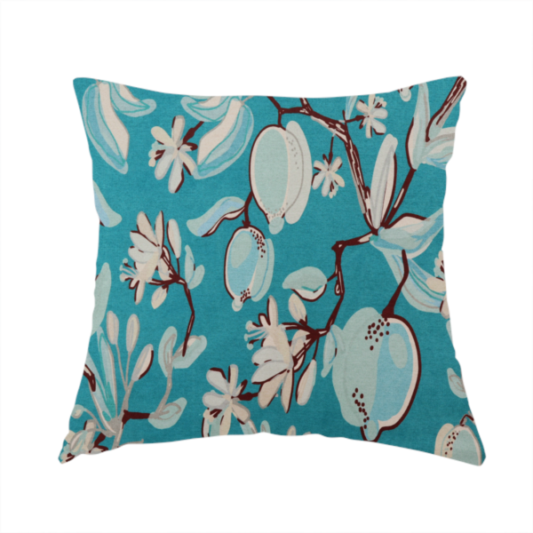 The fabric used to create this handmade cushion  is a botanical fabric design with trailing branches adorned with oval citrus fruit motifs, leaves, and small blossoms.