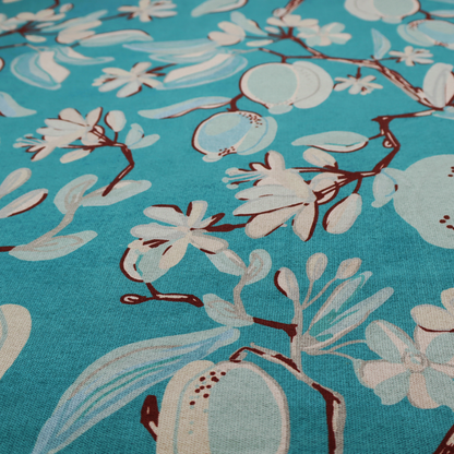 A botanical fabric design with trailing branches adorned with oval citrus fruit motifs, leaves, and small blossoms.