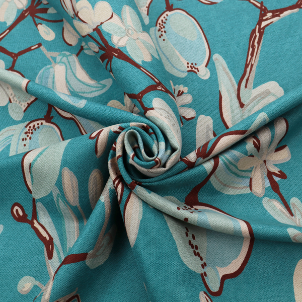 A botanical fabric design with trailing branches adorned with oval citrus fruit motifs, leaves, and small blossoms.