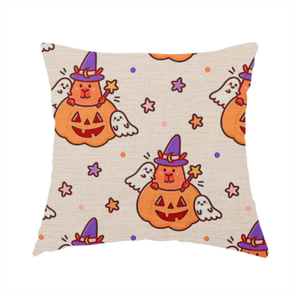 The fabric used to create this handmade cushion is a seamless, repeating Halloween-themed pattern featuring cute capybaras dressed as witches with purple hats and holding magic star wands, peeking out of carved jack-o'-lantern pumpkins, accompanied by friendly little ghosts, orange and purple stars, and polka dots on a light fabric-textured background.
