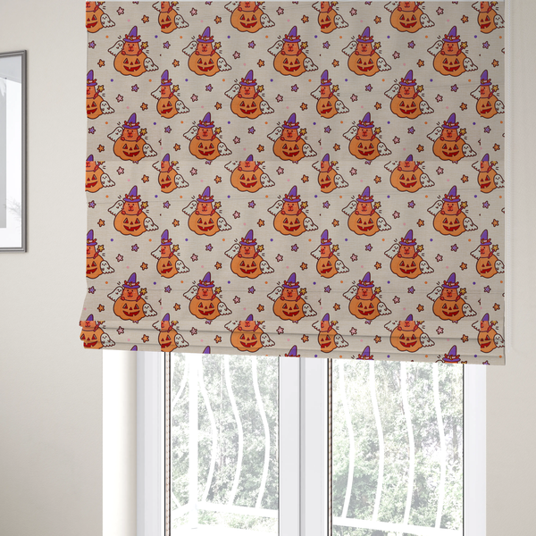 The fabric used to create these Roman blinds is a seamless, repeating Halloween-themed pattern featuring cute capybaras dressed as witches with purple hats and holding magic star wands, peeking out of carved jack-o'-lantern pumpkins, accompanied by friendly little ghosts, orange and purple stars, and polka dots on a light fabric-textured background.