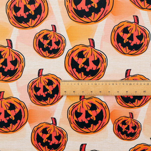 A seamless, repeating Halloween-themed pattern featuring vibrant orange carved jack-o'-lantern pumpkins with bold, black spooky expressions and lined details set against an abstract geometric orange and cream background.