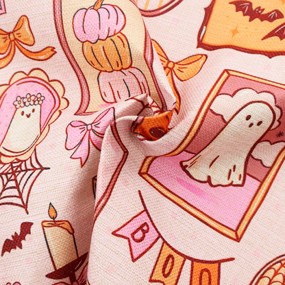 A seamless, repeating Halloween-themed pattern featuring a pink gallery wall filled with framed art, including cute ghosts, stacked pumpkins, a witch hat, a "Spooky Season" sign, bats, mushrooms, bows, spiderwebs, candles, and a skeletal peace sign hand on a light pink textured background.