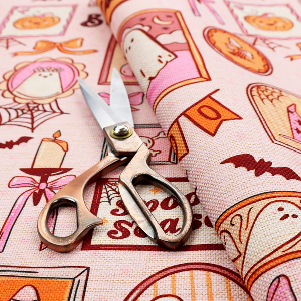 A seamless, repeating Halloween-themed pattern featuring a pink gallery wall filled with framed art, including cute ghosts, stacked pumpkins, a witch hat, a "Spooky Season" sign, bats, mushrooms, bows, spiderwebs, candles, and a skeletal peace sign hand on a light pink textured background.