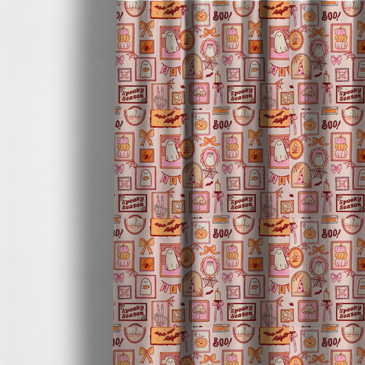 The fabric used to create these made-to-measure curtains is a seamless, repeating Halloween-themed pattern featuring a pink gallery wall filled with framed art, including cute ghosts, stacked pumpkins, a witch hat, a "Spooky Season" sign, bats, mushrooms, bows, spiderwebs, candles, and a skeletal peace sign hand on a light pink textured background.