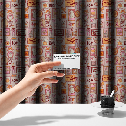 The fabric used to create these made-to-measure curtains is a seamless, repeating Halloween-themed pattern featuring a pink gallery wall filled with framed art, including cute ghosts, stacked pumpkins, a witch hat, a "Spooky Season" sign, bats, mushrooms, bows, spiderwebs, candles, and a skeletal peace sign hand on a light pink textured background.