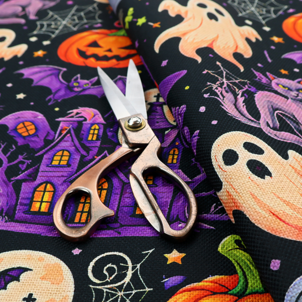 A seamless, repeating Halloween-themed pattern featuring a spooky black background crowded with a haunted purple house, a dancing skeleton, a boiling cauldron with green potion, smiling jack-o'-lantern pumpkins, friendly ghosts, a purple witch hat, a purple cat, flying bats, spiders, spiderwebs, candy, and colourful stars.