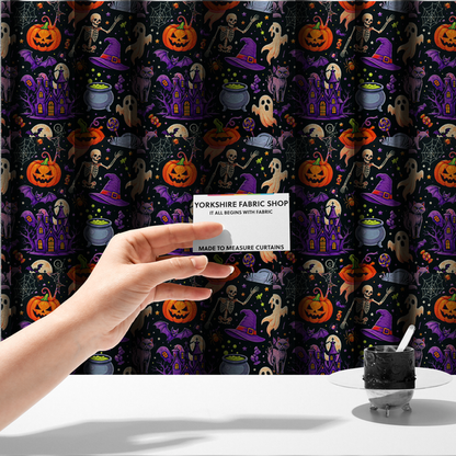 The fabric used to create these made-to-measure curtains is a seamless, repeating Halloween-themed pattern featuring a spooky black background crowded with a haunted purple house, a dancing skeleton, a boiling cauldron with green potion, smiling jack-o'-lantern pumpkins, friendly ghosts, a purple witch hat, a purple cat, flying bats, spiders, spiderwebs, candy, and colourful stars.