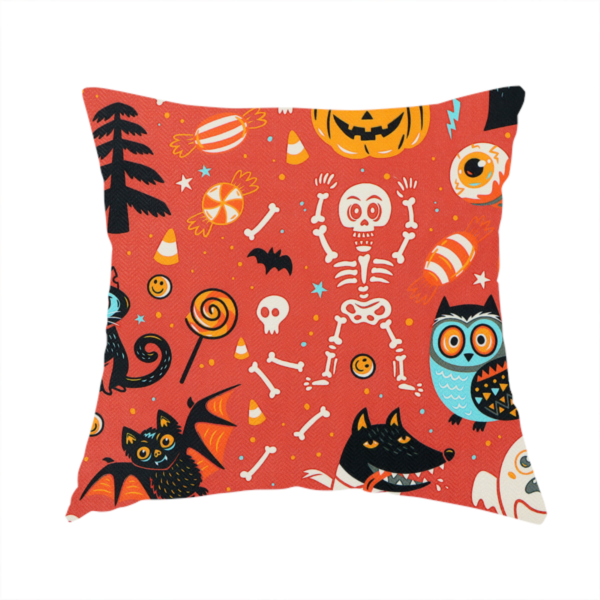 The fabric used to create this handmade cushion is a seamless, repeating Halloween-themed pattern featuring a vibrant red-orange background filled with a dancing skeleton, vampires, a mummified dog, a blue owl, black cats, a flying bat, ghosts, a jack-o'-lantern, candy, skulls, trees, and whimsical monsters.
