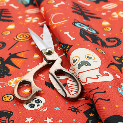 A seamless, repeating Halloween-themed pattern featuring a vibrant red-orange background filled with a dancing skeleton, vampires, a mummified dog, a blue owl, black cats, a flying bat, ghosts, a jack-o'-lantern, candy, skulls, trees, and whimsical monsters.