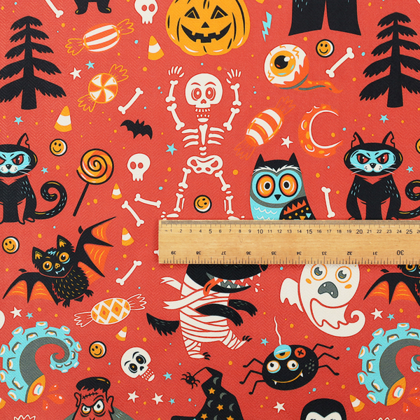 A seamless, repeating Halloween-themed pattern featuring a vibrant red-orange background filled with a dancing skeleton, vampires, a mummified dog, a blue owl, black cats, a flying bat, ghosts, a jack-o'-lantern, candy, skulls, trees, and whimsical monsters.
