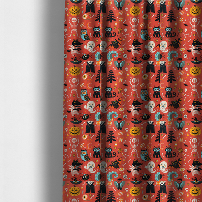 The fabric used to create these made-to-measure curtains is a seamless, repeating Halloween-themed pattern featuring a vibrant red-orange background filled with a dancing skeleton, vampires, a mummified dog, a blue owl, black cats, a flying bat, ghosts, a jack-o'-lantern, candy, skulls, trees, and whimsical monsters.