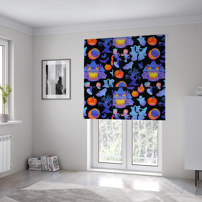 The fabric used to create these Roman blinds is a seamless, repeating Halloween-themed pattern featuring a black background filled with glowing blue haunted houses, flying ghosts, orange jack-o'-lanterns, gnarled trees, bats, a crescent moon, and fleeing children.
