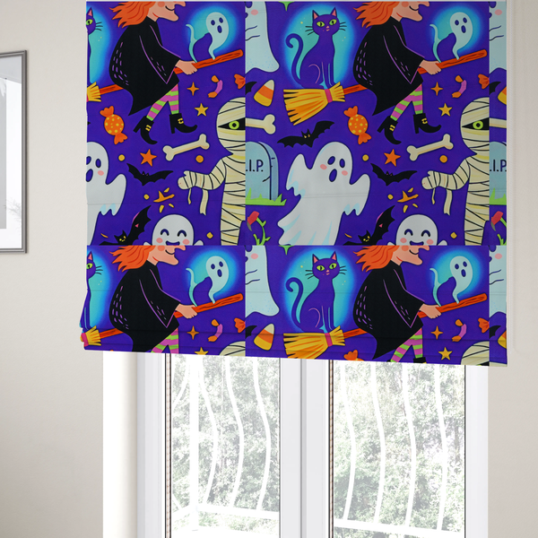 The fabric used to create these roman blinds is a seamless, repeating Halloween-themed pattern featuring a vibrant purple background filled with a witch riding a broomstick with a black cat, a mummified figure, ghosts, bats, a tombstone, bones, candy, and stars.