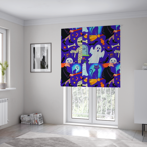 The fabric used to create these roman blinds is a seamless, repeating Halloween-themed pattern featuring a vibrant purple background filled with a witch riding a broomstick with a black cat, a mummified figure, ghosts, bats, a tombstone, bones, candy, and stars.
