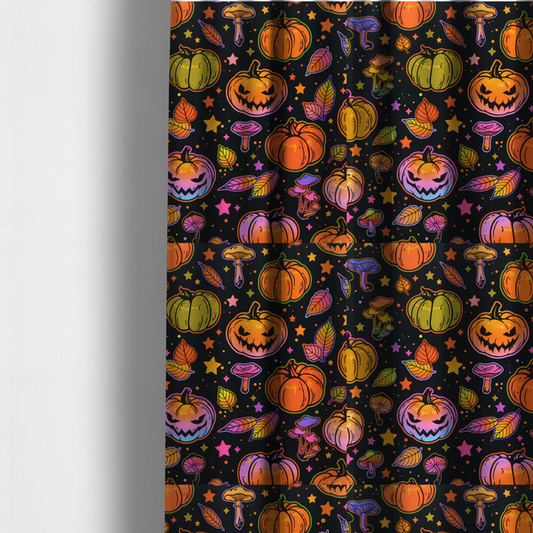 The fabric used to create these made-to-measure curtains is a seamless, repeating Halloween and autumn-themed pattern featuring a black background filled with colourful carved jack-o'-lanterns, pumpkins, mushrooms, autumn leaves, and glowing stars.
