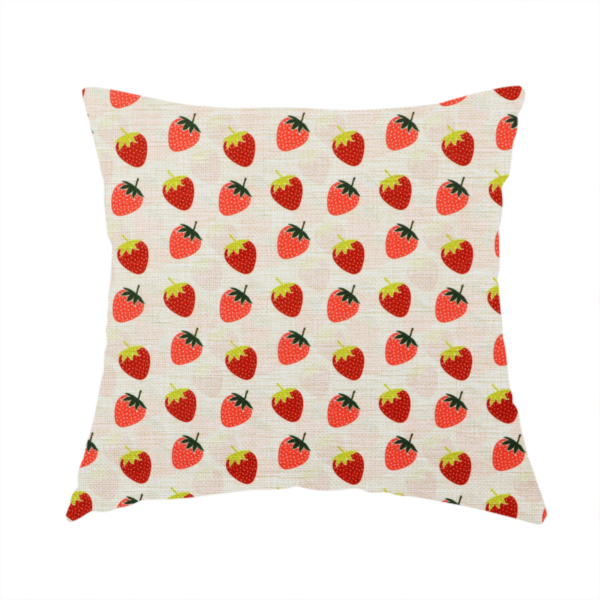 The fabric used to create this handmade cushion is a repeating pattern of small, red strawberries with green stems and leaves, set against a light-toned, textured background with a subtle checked design.