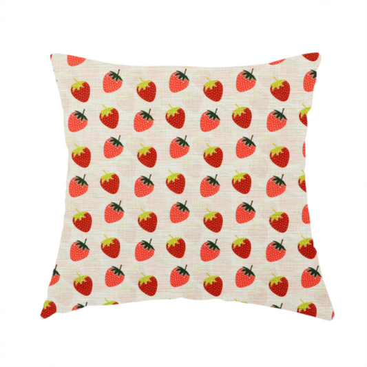 The fabric used to create this handmade cushion is a repeating pattern of small, red strawberries with green stems and leaves, set against a light-toned, textured background with a subtle checked design.