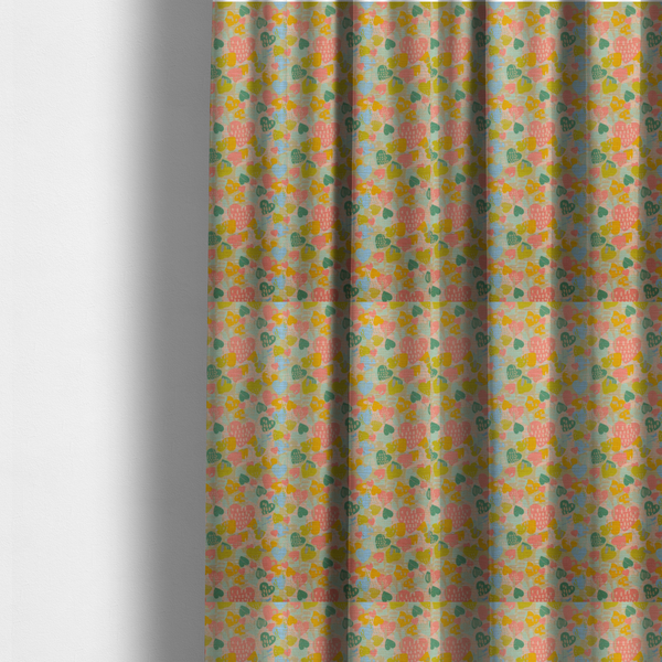 The fabric used to create these made-to-measure curtains is a colourful repeating pattern of overlapping hearts in shades of pink, teal, yellow, and blue, set against a textured background.