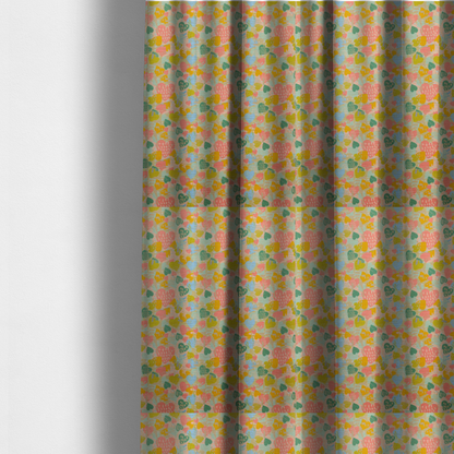 The fabric used to create these made-to-measure curtains is a colourful repeating pattern of overlapping hearts in shades of pink, teal, yellow, and blue, set against a textured background.