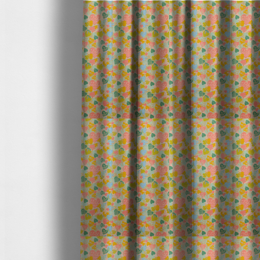 The fabric used to create these made-to-measure curtains is a colourful repeating pattern of overlapping hearts in shades of pink, teal, yellow, and blue, set against a textured background.