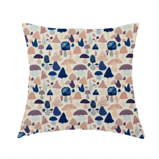 The fabric used to create this handmade cushion is a repeating pattern of various stylized mushrooms in shades of blue, purple, and tan, set against a light-toned, textured background.