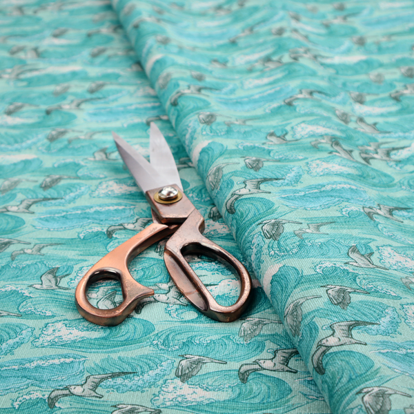 A repeating pattern of crashing ocean waves and soaring seagulls rendered in shades of teal and white.