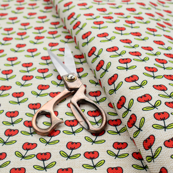 A repeating pattern of small red tulips with green stems and leaves, set against a light-toned, textured background.