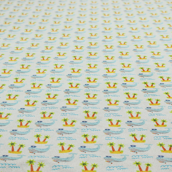 A repeating pattern of small blue whales wearing captain's hats swimming near tiny tropical islands with palm trees, set against a light grey background with small blue wave lines.