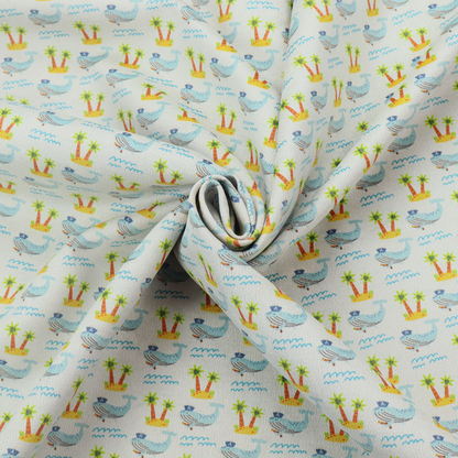 A repeating pattern of small blue whales wearing captain's hats swimming near tiny tropical islands with palm trees, set against a light grey background with small blue wave lines.