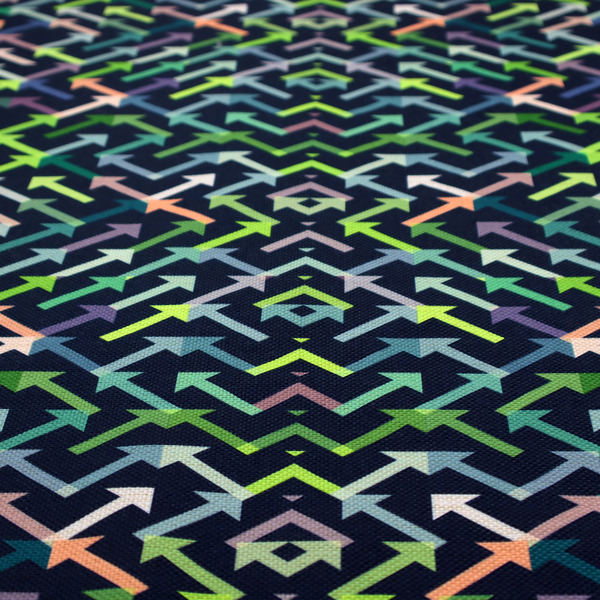 A geometric repeating pattern of intersecting lines and arrows in shades of green, blue, and peach, set against a dark navy background.