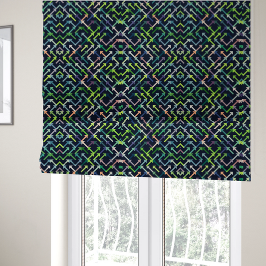 The fabric used to create these Roman blinds is a geometric repeating pattern of intersecting lines and arrows in shades of green, blue, and peach, set against a dark navy background.