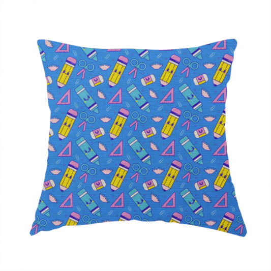 The fabric used to create this handmade cushion is a repeating pattern of cute, kawaii-style school supplies including pencils, crayons, scissors, and rulers on a vibrant blue background.