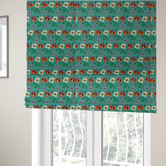 The fabric used to create these Roman blinds is a repeating pattern of quirky, cartoonish motifs including smiling eggs, stylized red hearts with faces, wiggly green pencils, and pink star-like shapes on a teal background.