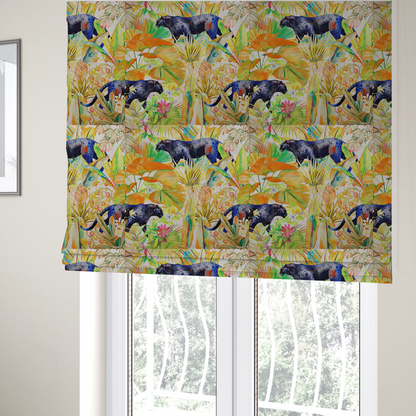 The fabric used to create these Roman blinds is a vibrant tropical pattern featuring prowling dark leopards and jaguars hidden among lush jungle foliage, oversized palm leaves, and bright floral accents in warm and cool tones.