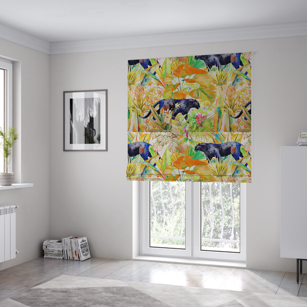 The fabric used to create these Roman blinds is a vibrant tropical pattern featuring prowling dark leopards and jaguars hidden among lush jungle foliage, oversized palm leaves, and bright floral accents in warm and cool tones.