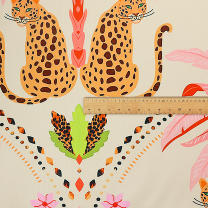 A symmetrical, repeating tropical pattern on a light background featuring stylized leopards sitting below bright pink and red palm trees, accented with pink flowers, green foliage, and geometric dotted arches.