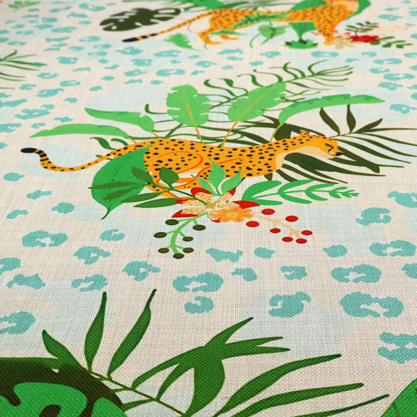 A repeating pattern featuring spotted cheetahs amidst lush green tropical leaves, red floral accents, and a teal leopard print background.