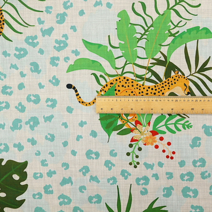 A repeating pattern featuring spotted cheetahs amidst lush green tropical leaves, red floral accents, and a teal leopard print background.