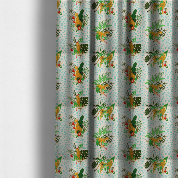 The fabric used to create these made-to-measure curtains is a repeating pattern featuring spotted cheetahs amidst lush green tropical leaves, red floral accents, and a teal leopard print background.