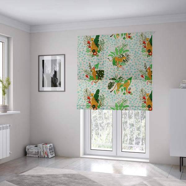 The fabric used to create these Roman blinds is a repeating pattern featuring spotted cheetahs amidst lush green tropical leaves, red floral accents, and a teal leopard print background.